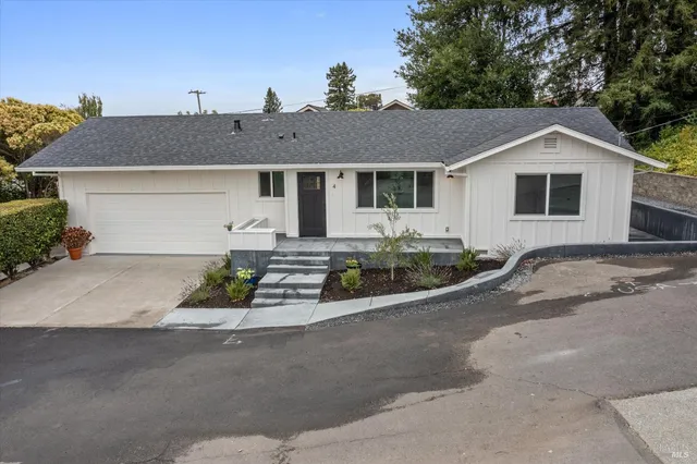 a front view of a house with yard