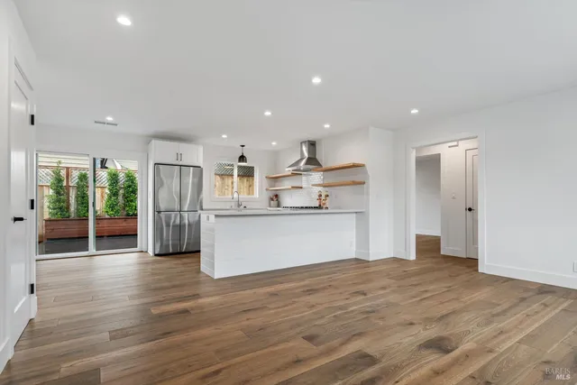a view of kitchen view wooden floor and window