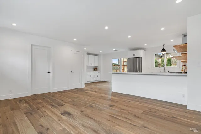 a view of kitchen and wooden floor