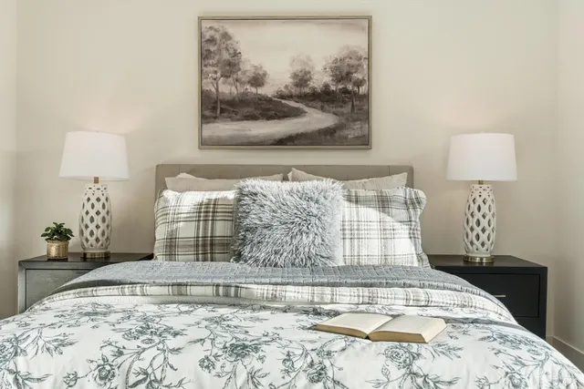 a view of water heater room with wooden floor