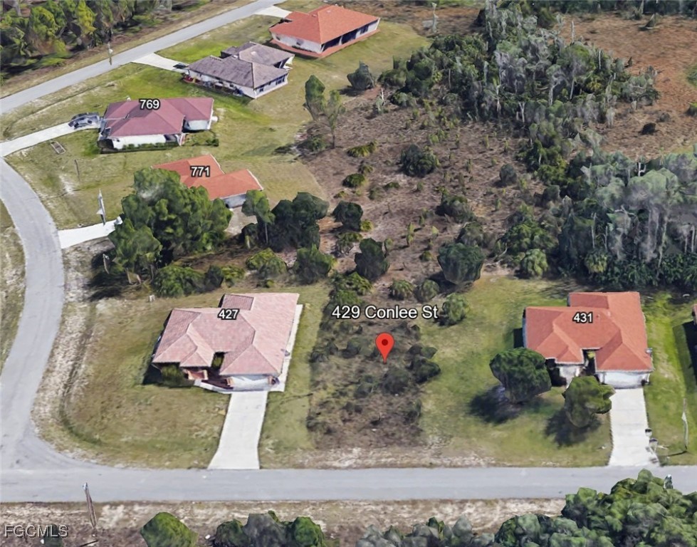 an aerial view of a house with swimming pool