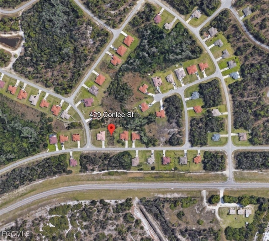 429 Conlee Street Lehigh Acres, FL 33974 - Photo 2 of 3 front view of a house with a yard