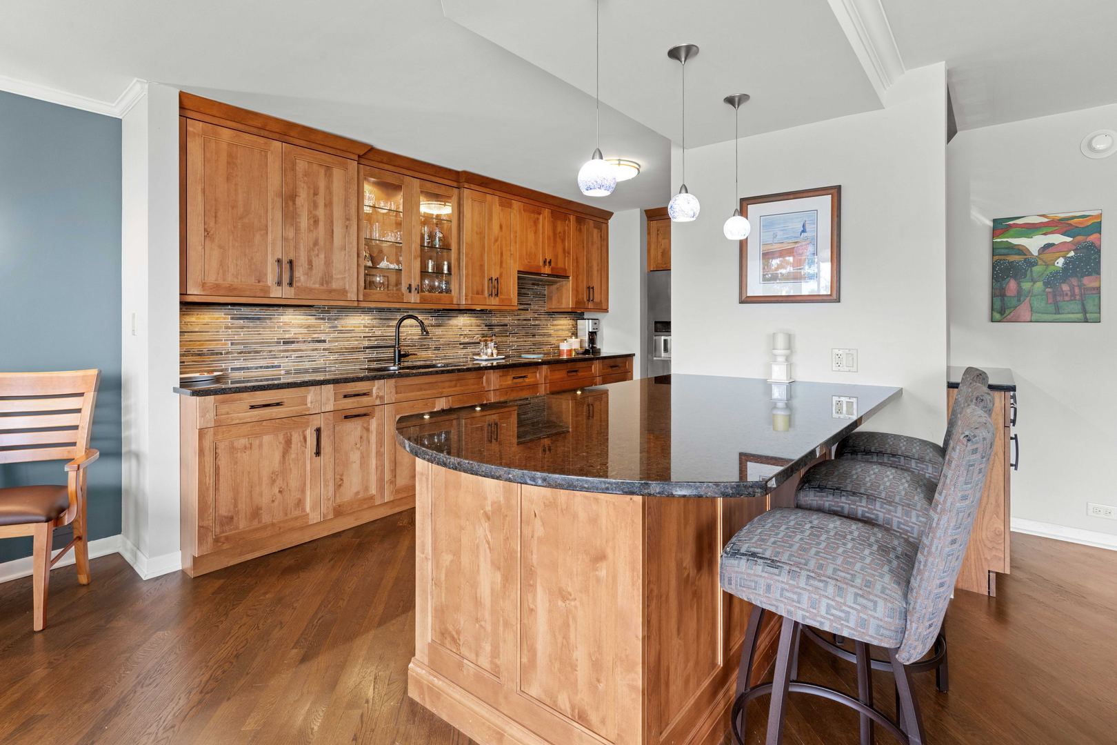 1630 Sheridan Road, Unit 4M Wilmette, IL 60091 - Photo 11 of 39 a kitchen with a table chairs sink and cabinets