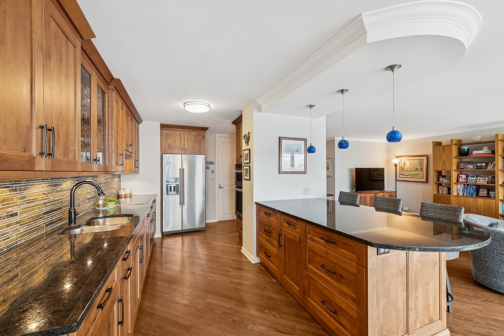1630 Sheridan Road, Unit 4M Wilmette, IL 60091 - Photo 16 of 39 a large kitchen with stainless steel appliances granite countertop a lot of counter space and wooden floor
