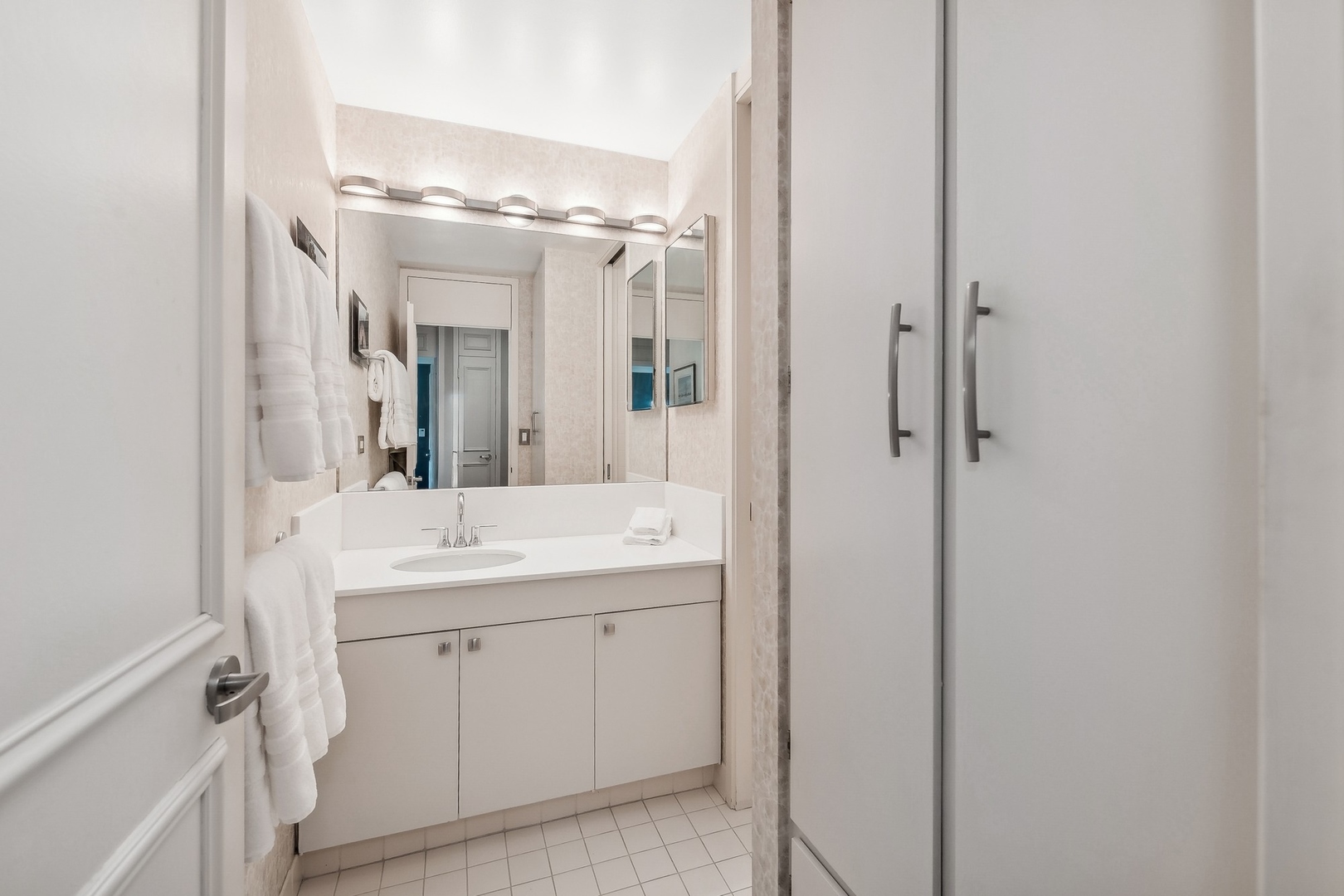 1630 Sheridan Road, Unit 4M Wilmette, IL 60091 - Photo 26 of 39 a spacious bathroom with a granite countertop sink a mirror and a shower