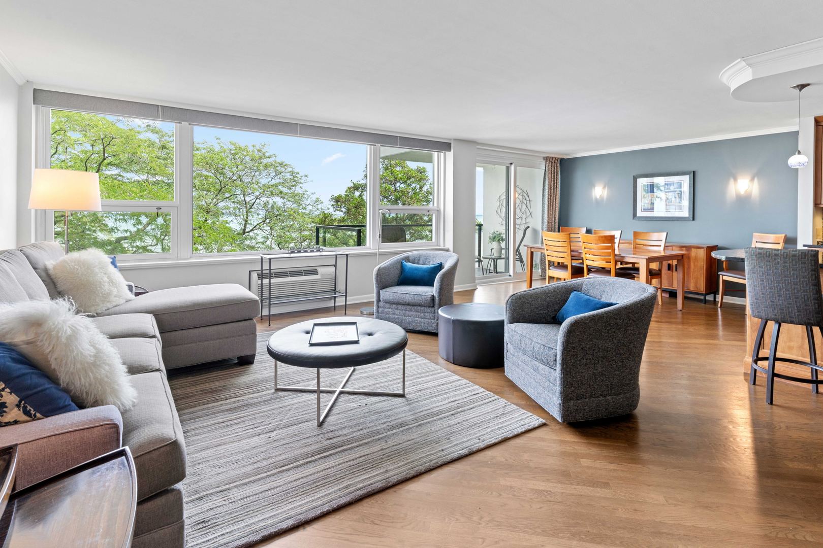 1630 Sheridan Road, Unit 4M Wilmette, IL 60091 - Photo 4 of 39 a living room with furniture and a large window