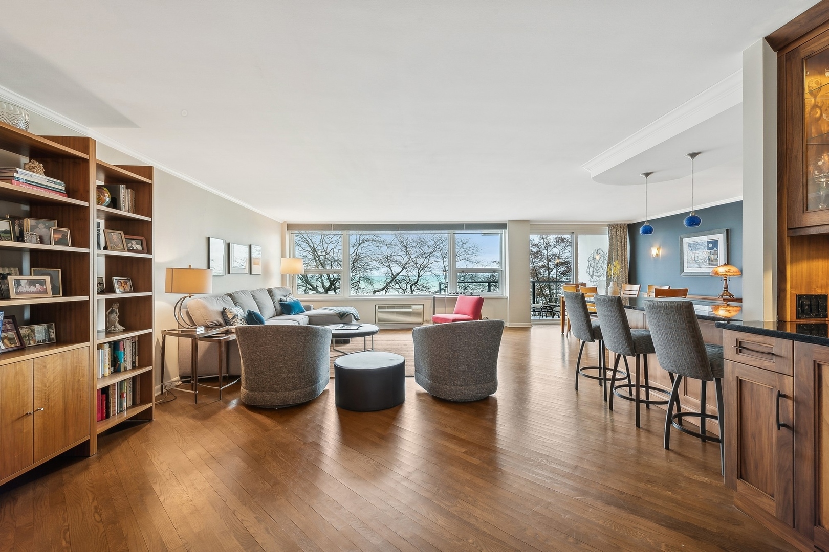 1630 Sheridan Road, Unit 4M Wilmette, IL 60091 - Photo 5 of 39 a living room with furniture a bookshelf and a window