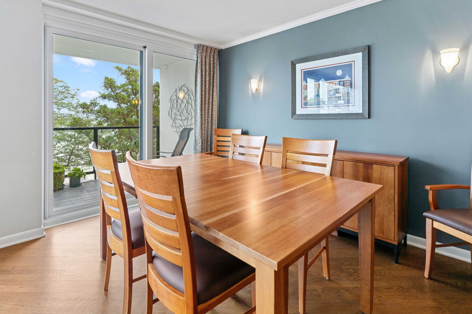 1630 Sheridan Road, Unit 4M Wilmette, IL 60091 - Photo 9 of 39 a dining room with furniture and wooden floor