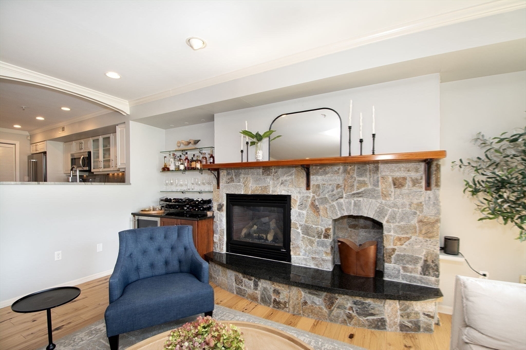 16 Ladds Way, Unit 16 Scituate, MA 02066 - Photo 11 of 40 a living room with furniture and a fireplace