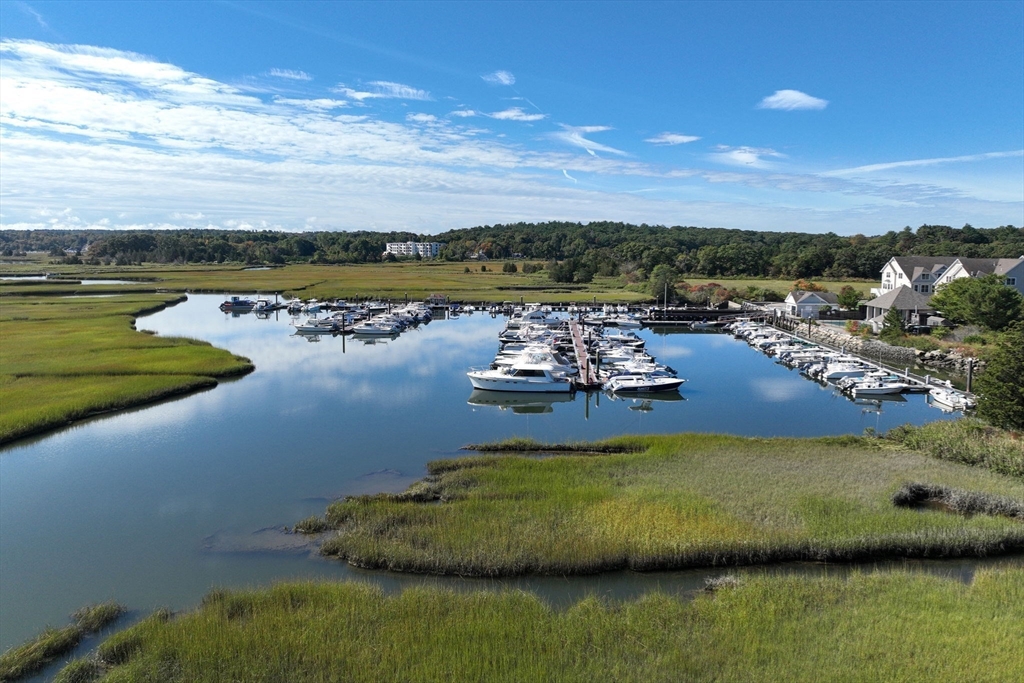 16 Ladds Way, Unit 16 Scituate, MA 02066 - Photo 2 of 40 a view of a lake with houses