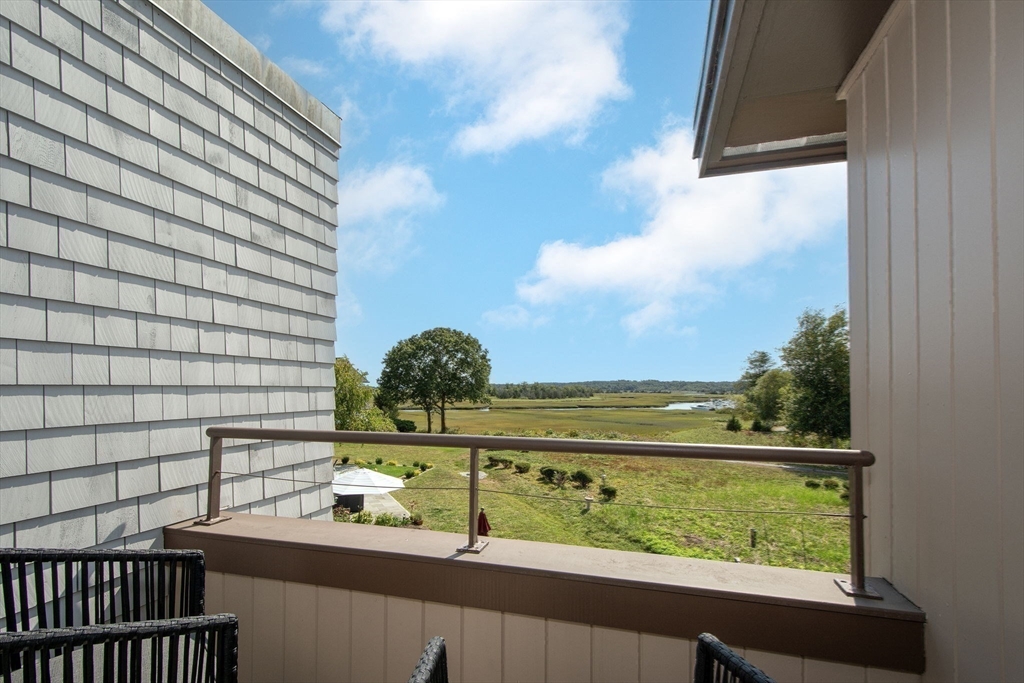 16 Ladds Way, Unit 16 Scituate, MA 02066 - Photo 22 of 40 a view of a lake from a balcony