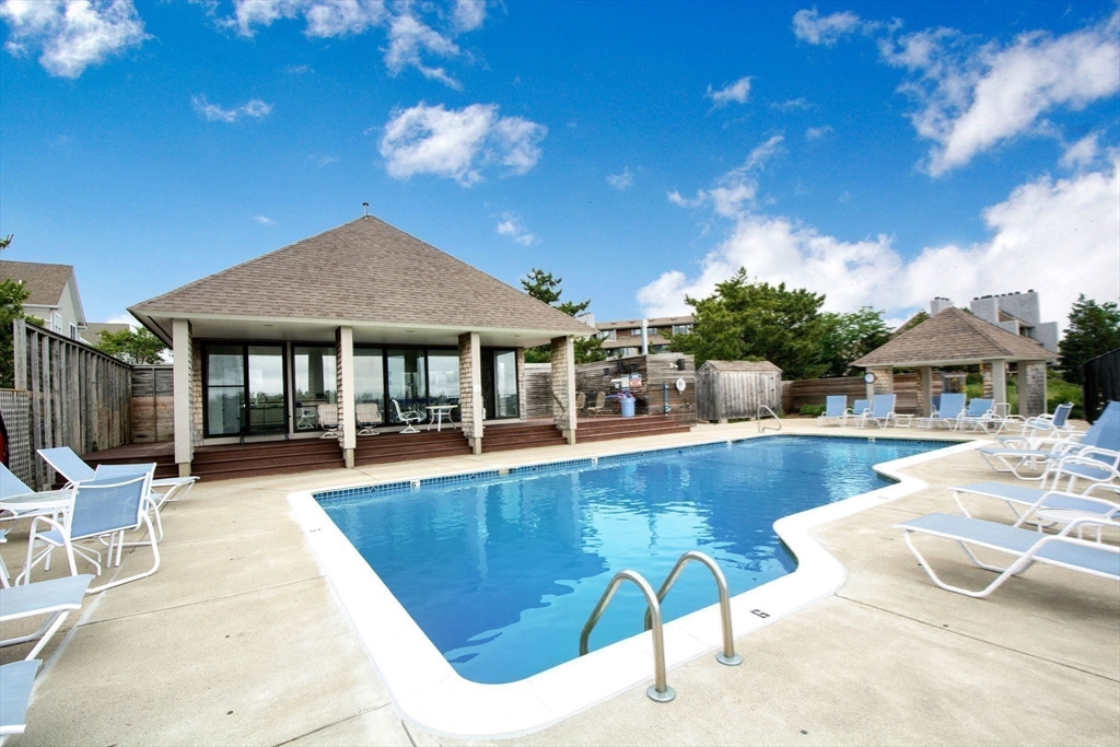 16 Ladds Way, Unit 16 Scituate, MA 02066 - Photo 35 of 40 a view of a house with swimming pool and sitting area