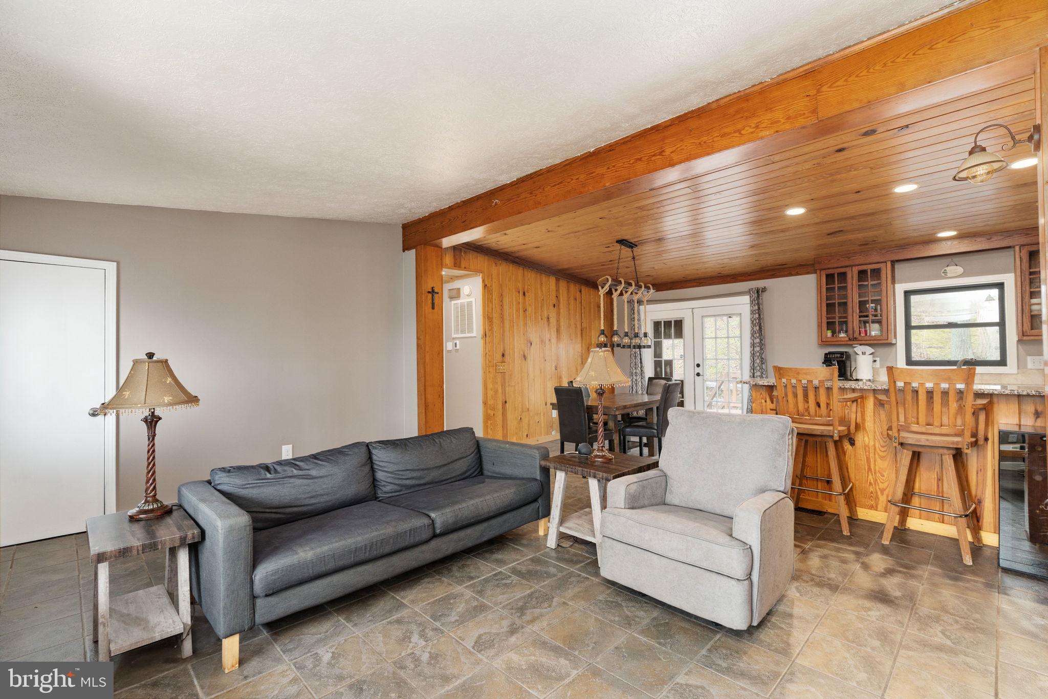 4098 Mountain Road Haymarket, VA 20169 - Photo 12 of 49 a living room with furniture a lamp and a large window