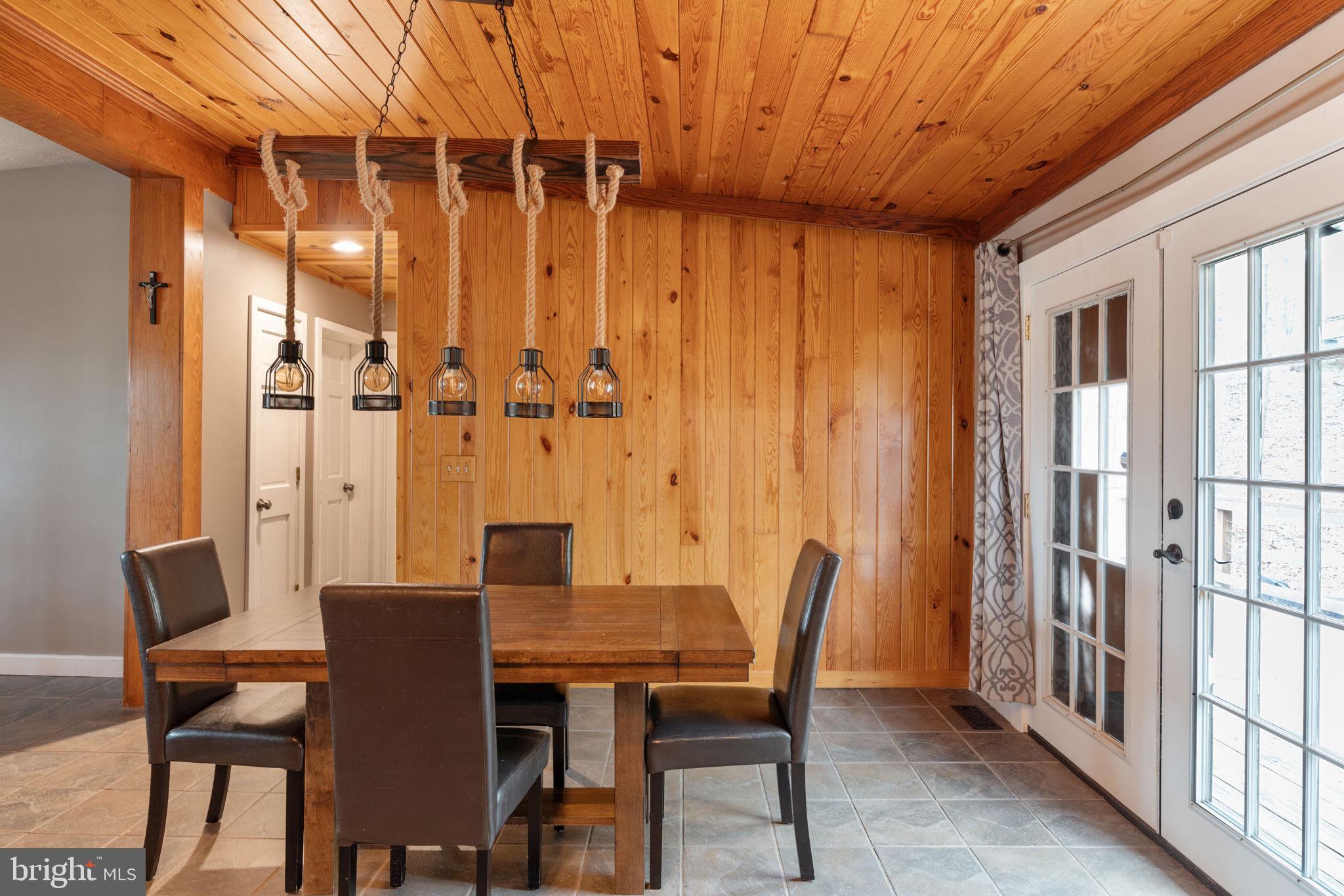 4098 Mountain Road Haymarket, VA 20169 - Photo 15 of 49 a view of a dining room with furniture and window