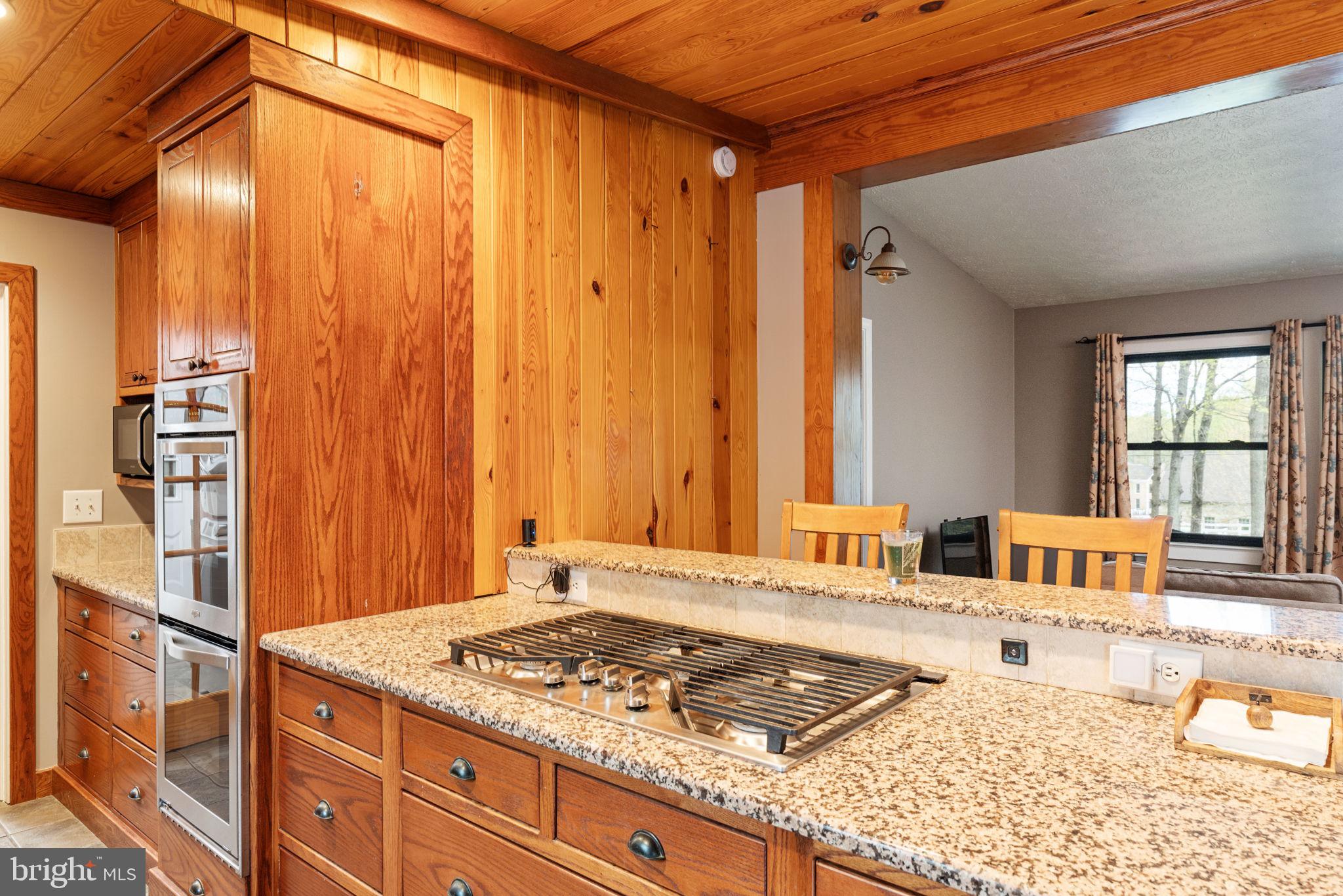 4098 Mountain Road Haymarket, VA 20169 - Photo 17 of 49 a bathroom with a granite countertop sink and a large mirror