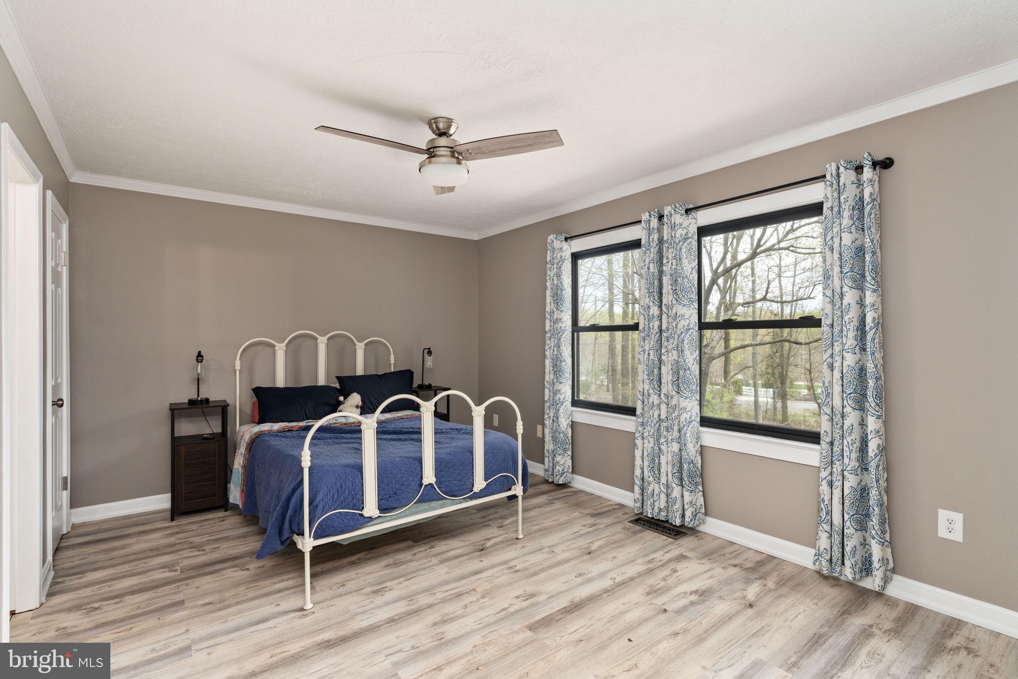 4098 Mountain Road Haymarket, VA 20169 - Photo 29 of 49 a view of a bedroom with furniture window and wooden floor