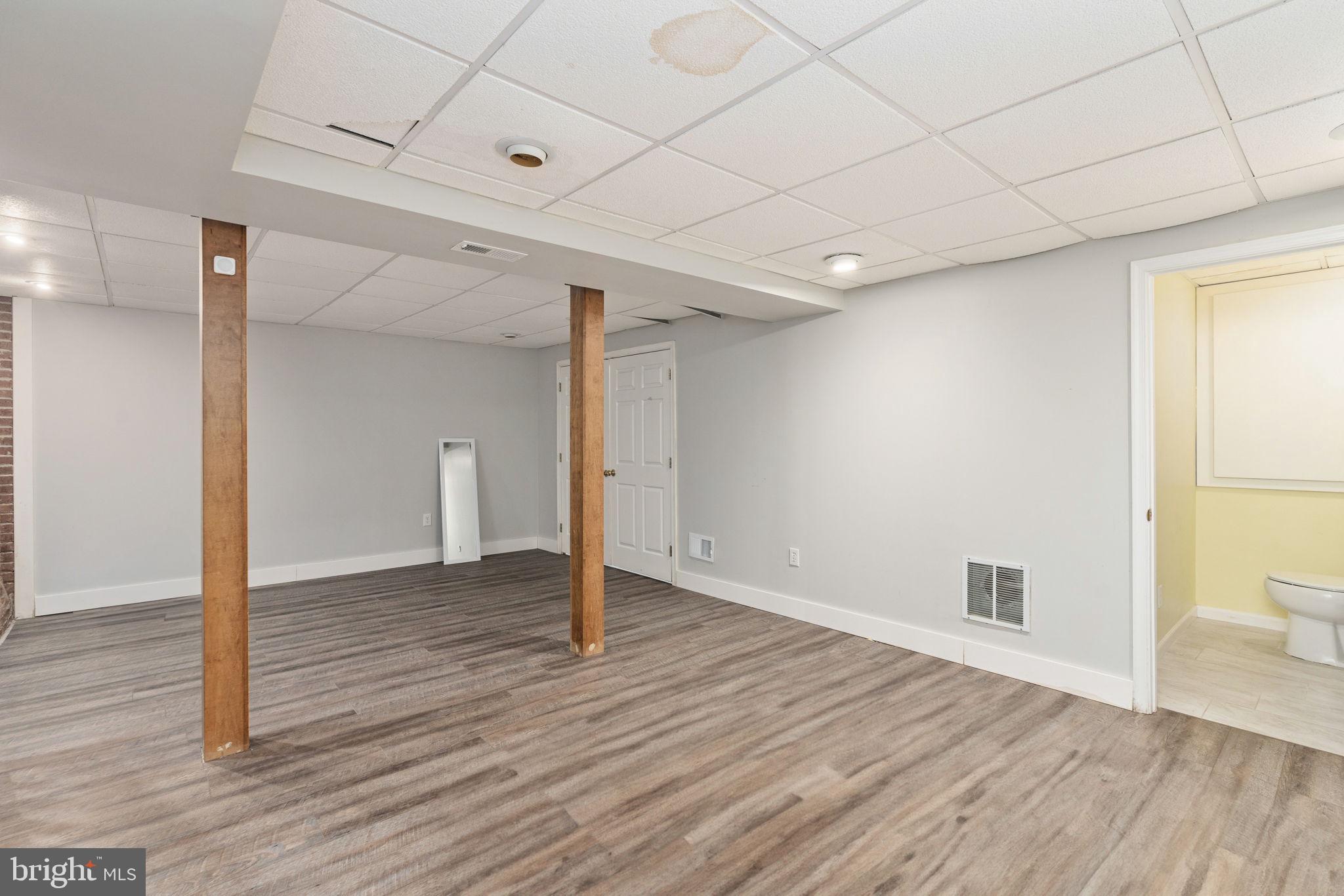 4098 Mountain Road Haymarket, VA 20169 - Photo 34 of 49 a view of an empty room with wooden floor and a window