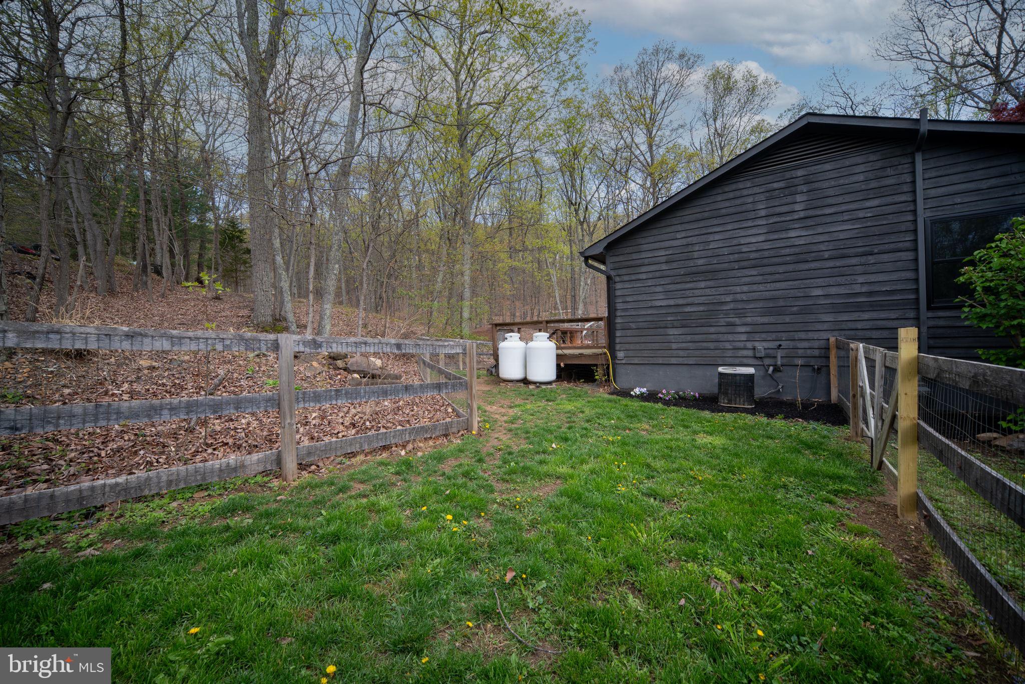 4098 Mountain Road Haymarket, VA 20169 - Photo 44 of 49 a backyard of a house with lots of green space