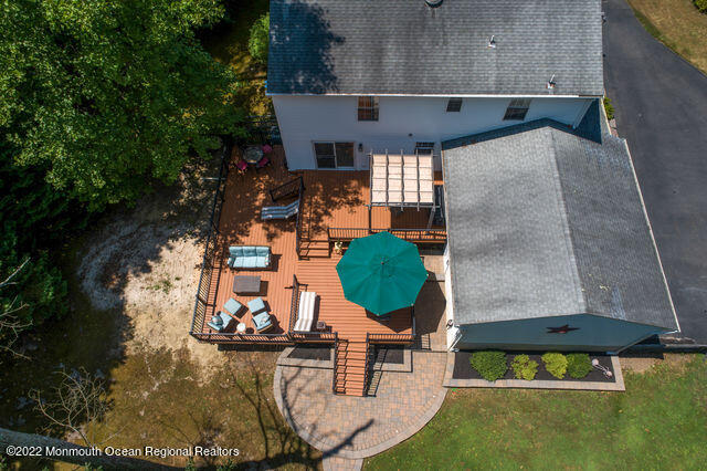340 East Millstream Road Cream Ridge, NJ 08514 - Photo 15 of 40 an aerial view of a swimming pool with outdoor seating