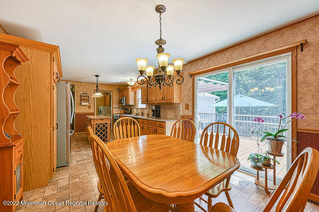 340 East Millstream Road Cream Ridge, NJ 08514 - Photo 2 of 40 a dining room with furniture a chandelier and wooden floor