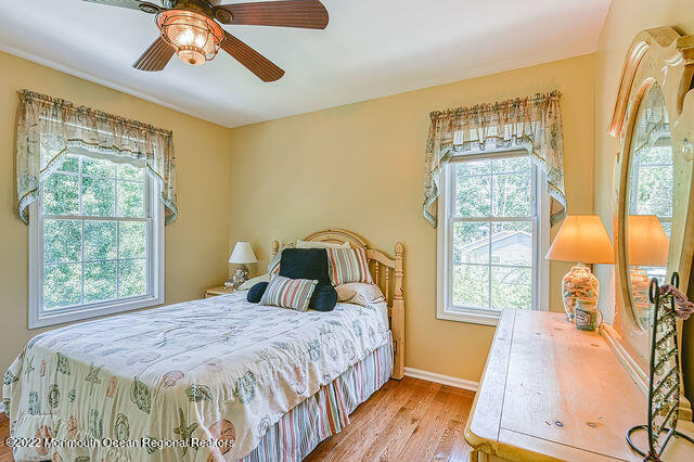 340 East Millstream Road Cream Ridge, NJ 08514 - Photo 21 of 40 a bedroom with a bed and wooden floor