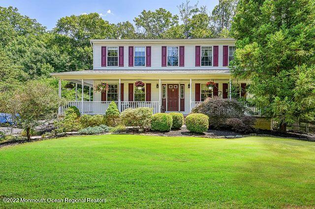 340 East Millstream Road Cream Ridge, NJ 08514 - Photo 10 of 40 a view of a brick house with a yard plants and large trees