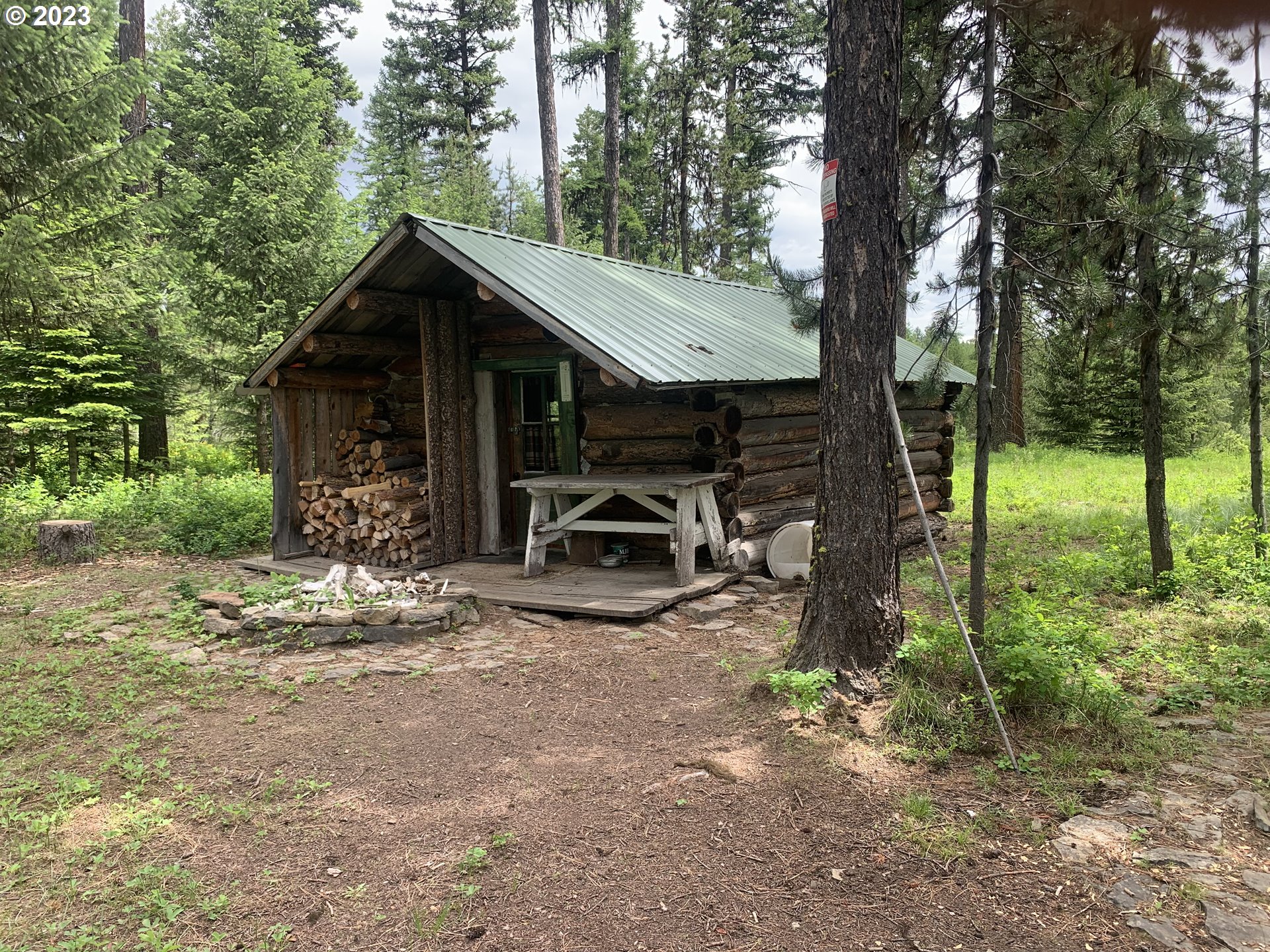 Cabin Wallowa, OR 97885 - Photo 2 of 7 a view of a house with backyard