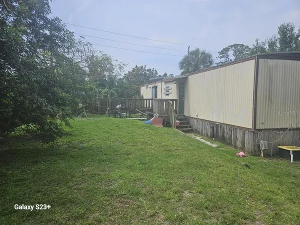 a view of a backyard with a garden and plants