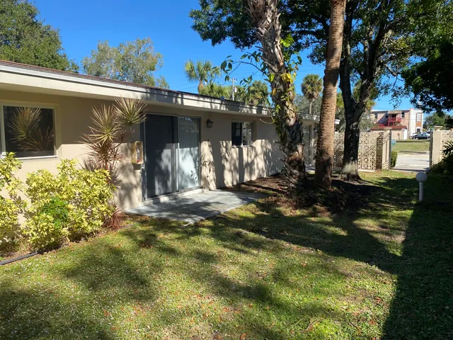 a view of a house with a small yard