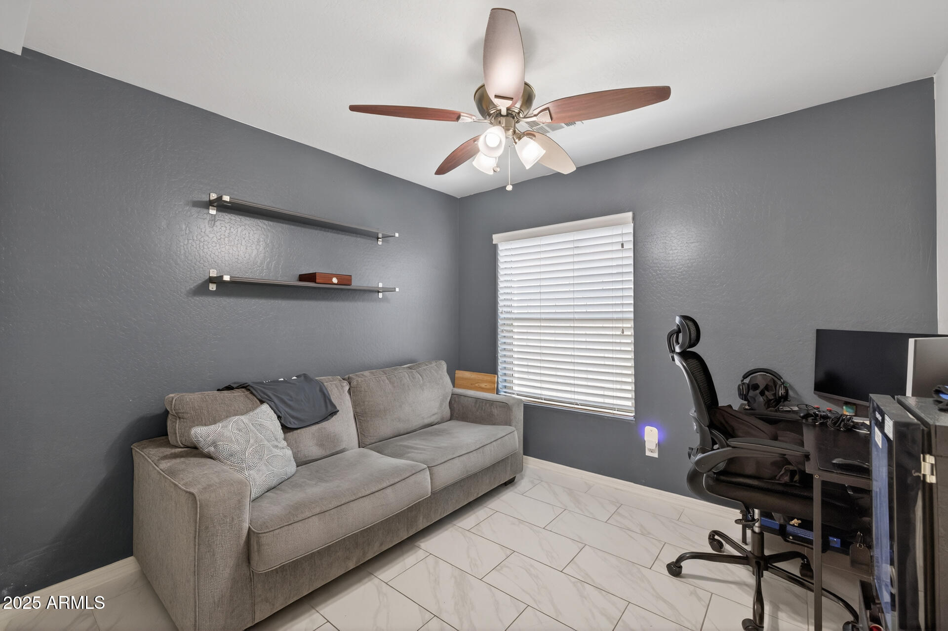 129 West Ian Drive Phoenix, AZ 85041 - Photo 15 of 21 a living room with furniture and a window