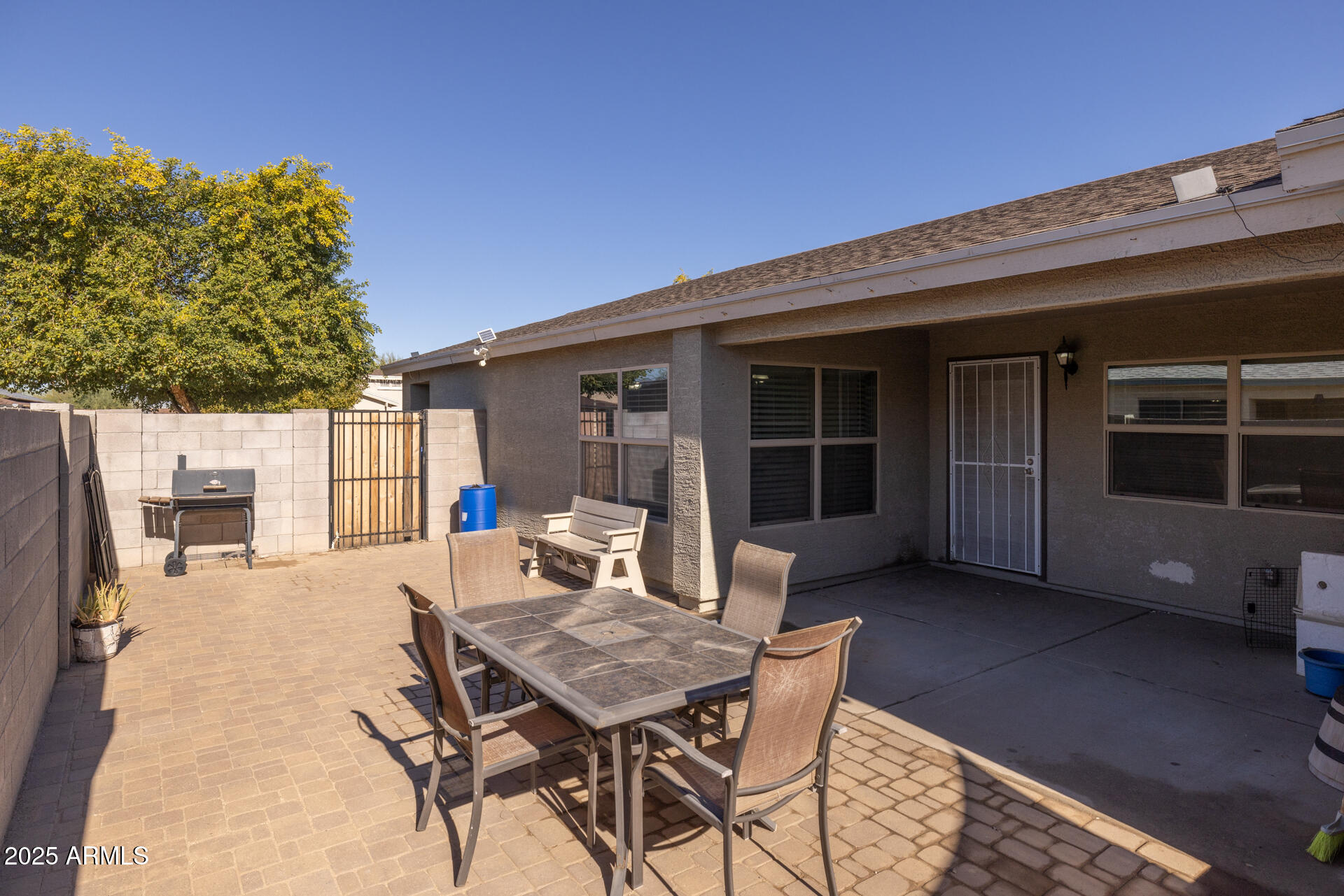 129 West Ian Drive Phoenix, AZ 85041 - Photo 18 of 21 a outdoor space with a table and chairs
