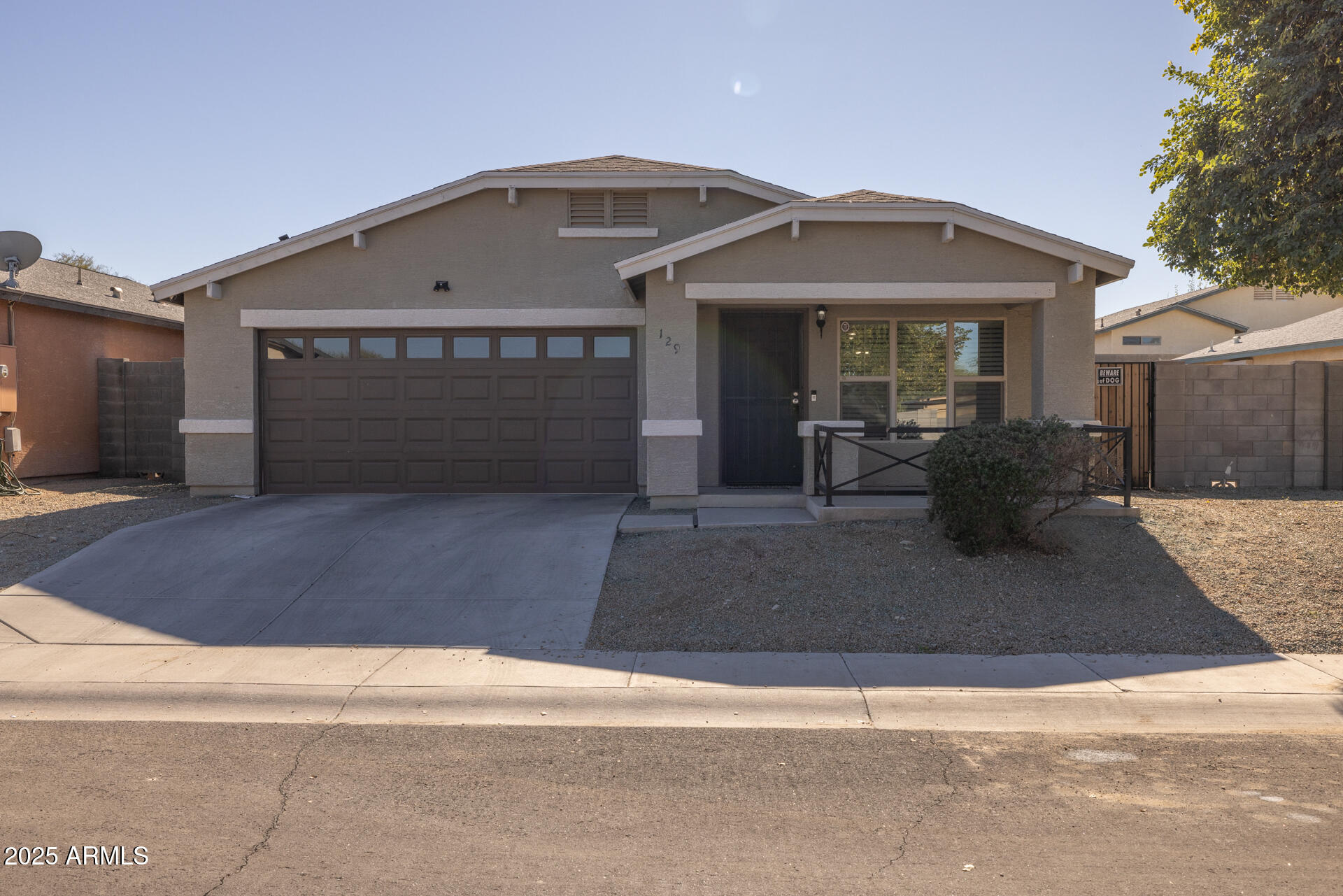 129 West Ian Drive Phoenix, AZ 85041 - Photo 20 of 21 a front view of a house with yard