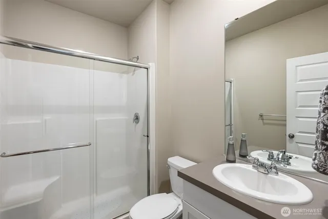 a bedroom with a bed chair and window