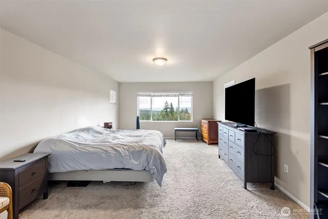 a spacious bathroom with a double vanity sink mirror and shower