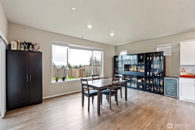 a living room with a fireplace and a flat screen tv