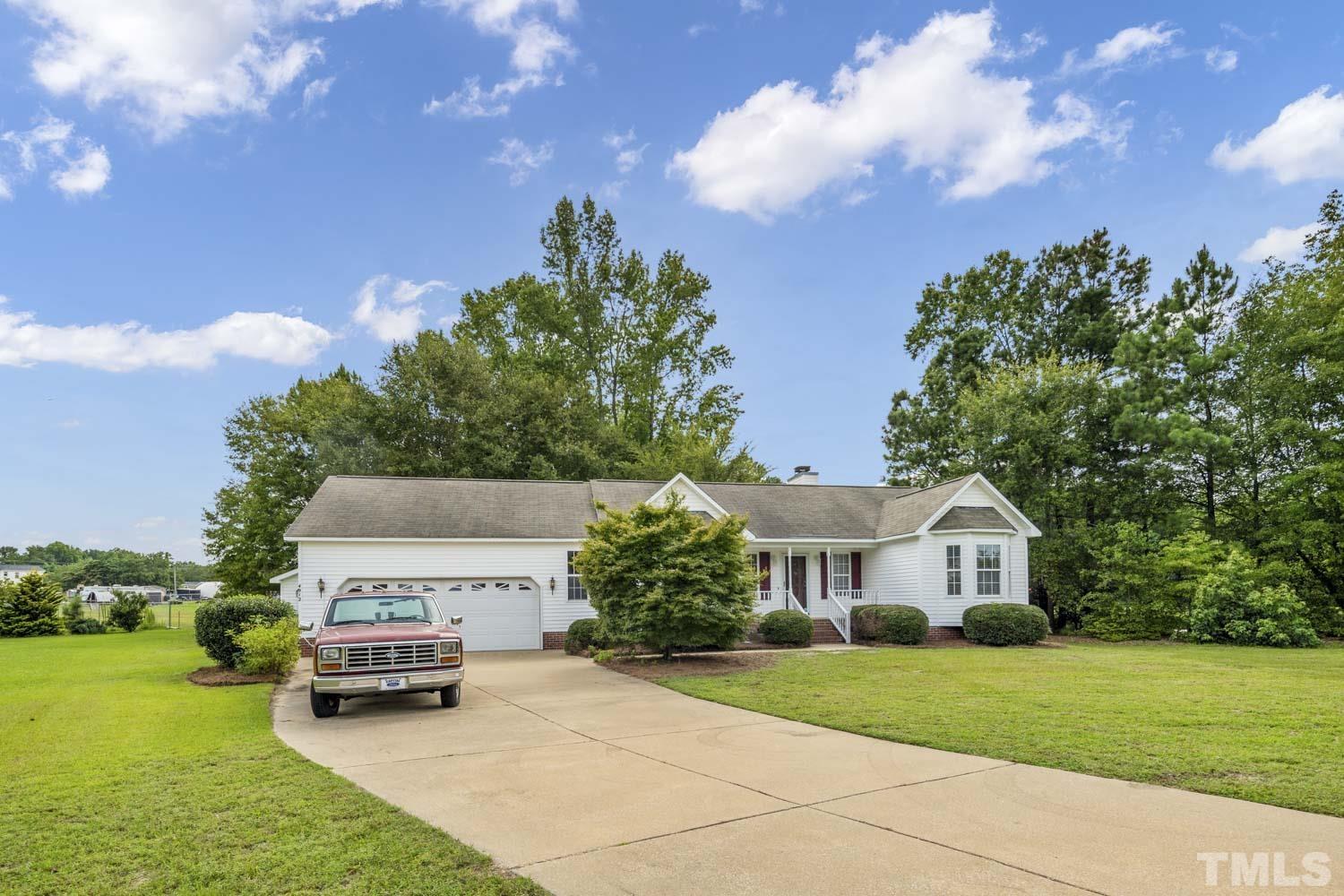 4912 Topstone Road Raleigh, NC 27603 - Photo 4 of 47 a front view of a house with garden