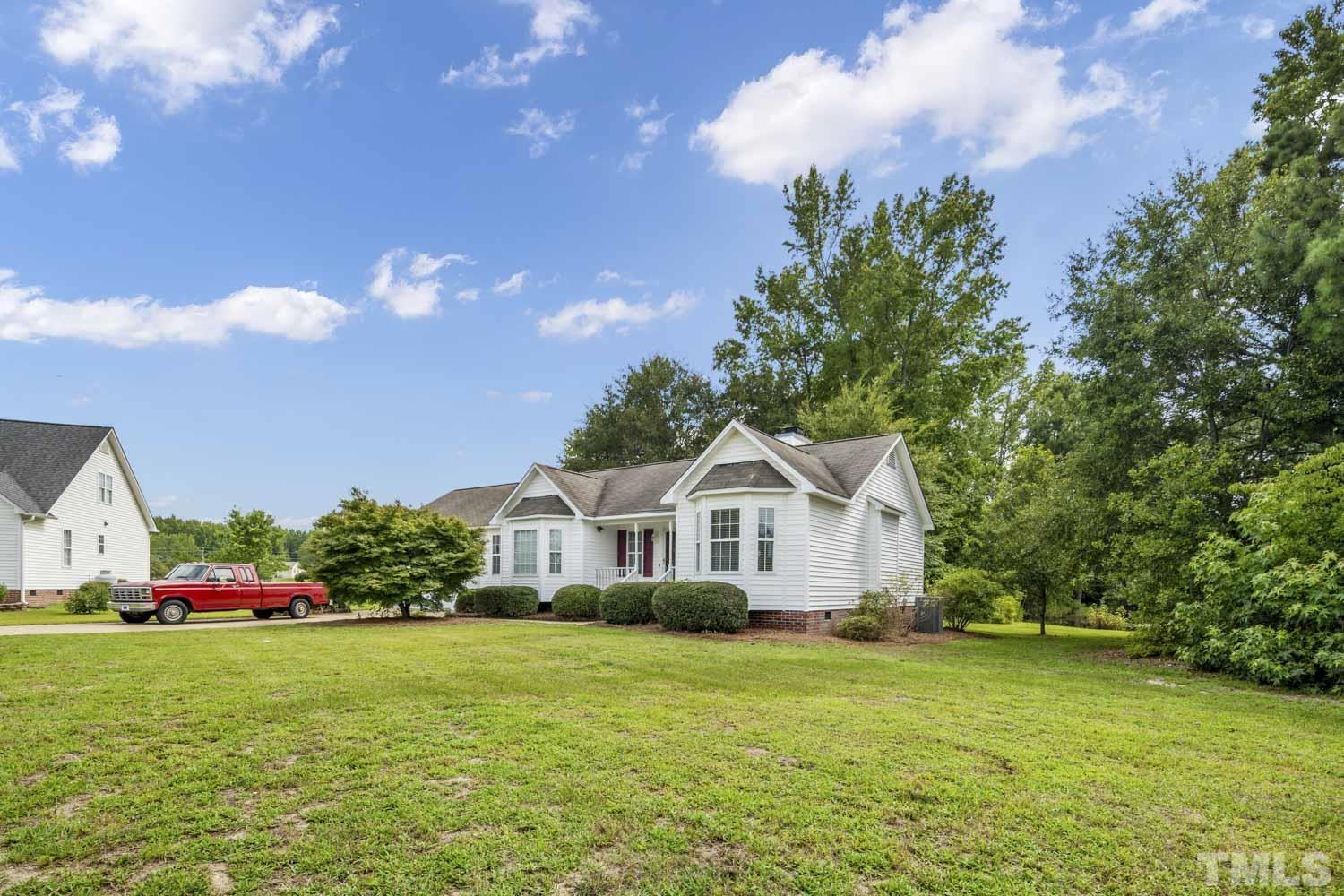 4912 Topstone Road Raleigh, NC 27603 - Photo 5 of 47 a front view of a house with garden