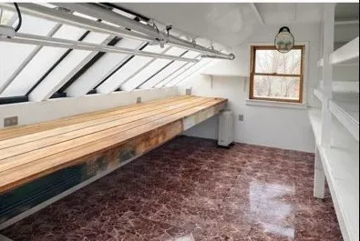 a kitchen with stainless steel appliances granite countertop a refrigerator a sink dishwasher and wooden cabinets with wooden floor