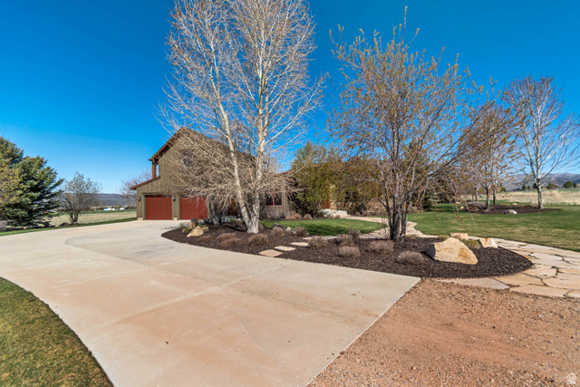 2579 Splendor Valley Road Kamas, UT 84036 - Photo 14 of 87 View of front of house with a front lawn, concrete driveway, and a garage