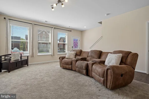 a living room with furniture and windows