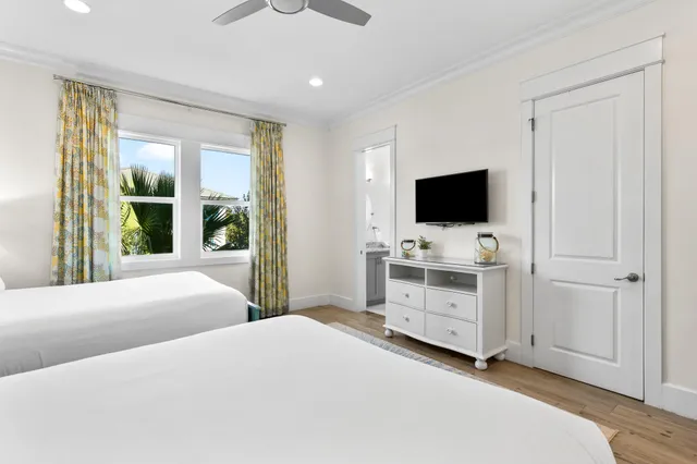 a kitchen with a sink cabinets and wooden floor