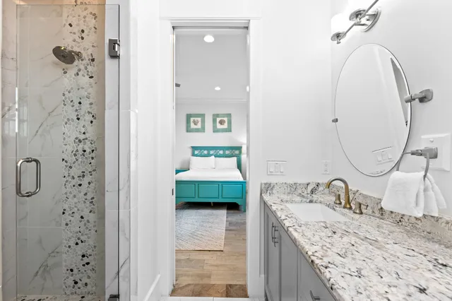 a bedroom with a large bed and a window