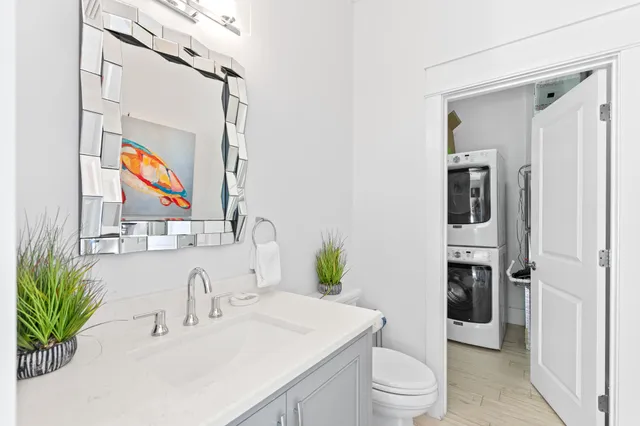 a bathroom with a white tub sitting next to a window