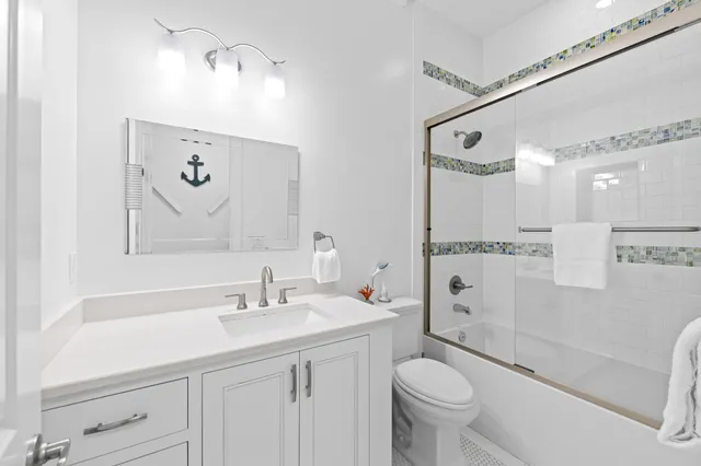 a view of a white house with wooden floor and iron stairs