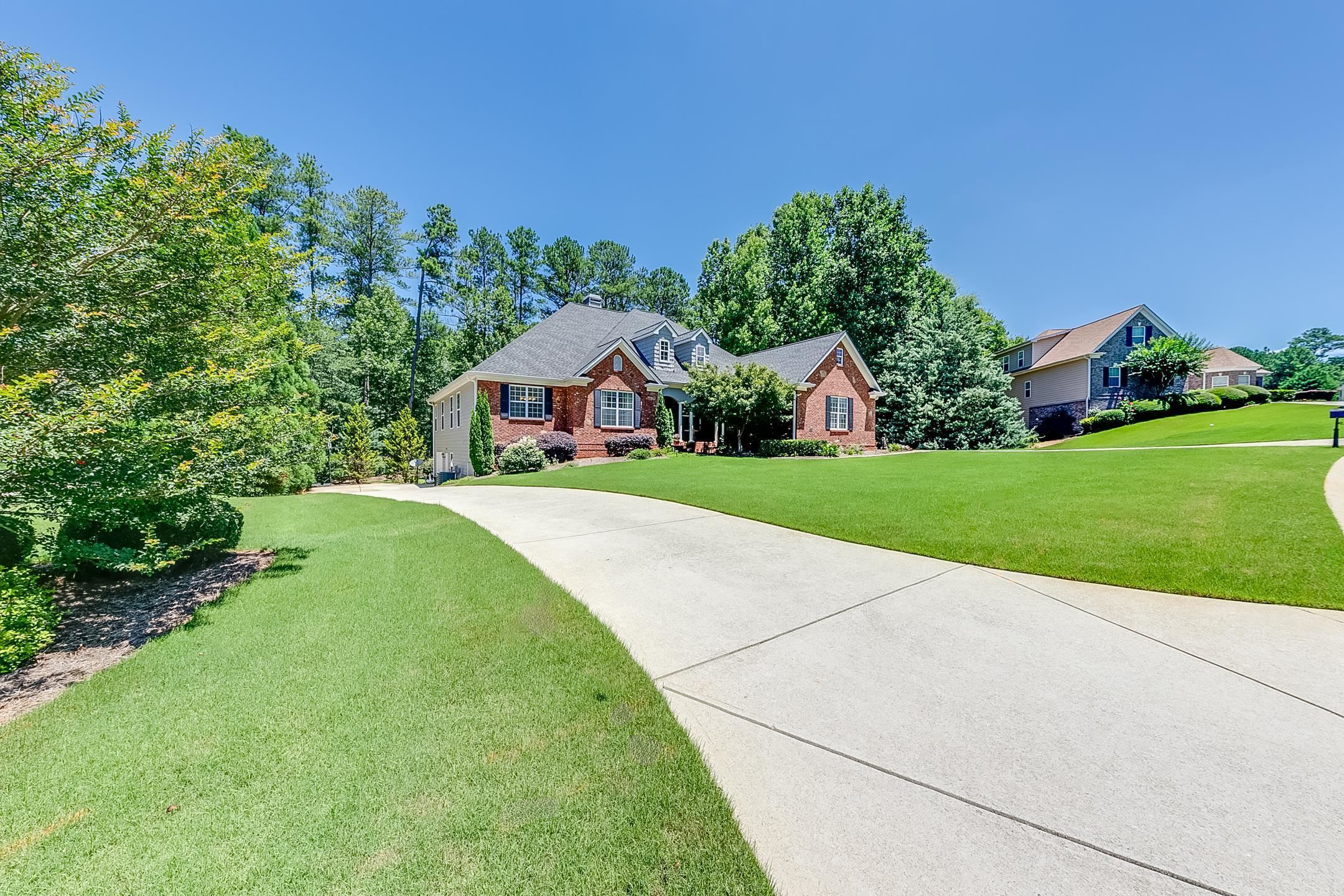 303 Vantage Drive Jefferson, GA 30549 - Photo 1 of 1 a house view with garden space and trees