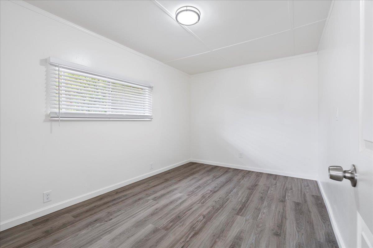 1525 Cold Springs Road, Unit 37 Placerville, CA 95667 - Photo 19 of 37 an empty room with wooden floor and windows