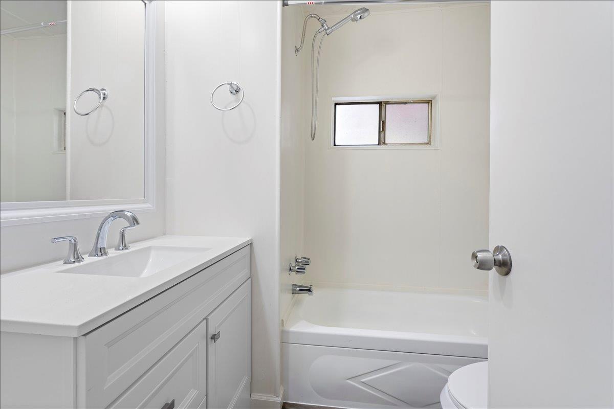 1525 Cold Springs Road, Unit 37 Placerville, CA 95667 - Photo 23 of 37 a bathroom with a granite countertop sink a toilet and shower