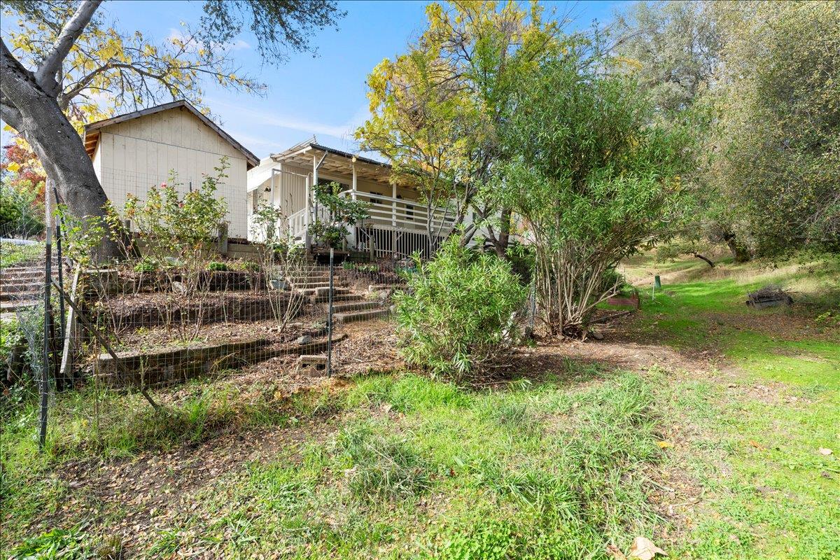 1525 Cold Springs Road, Unit 37 Placerville, CA 95667 - Photo 32 of 37 a view of a house with a yard and sitting area