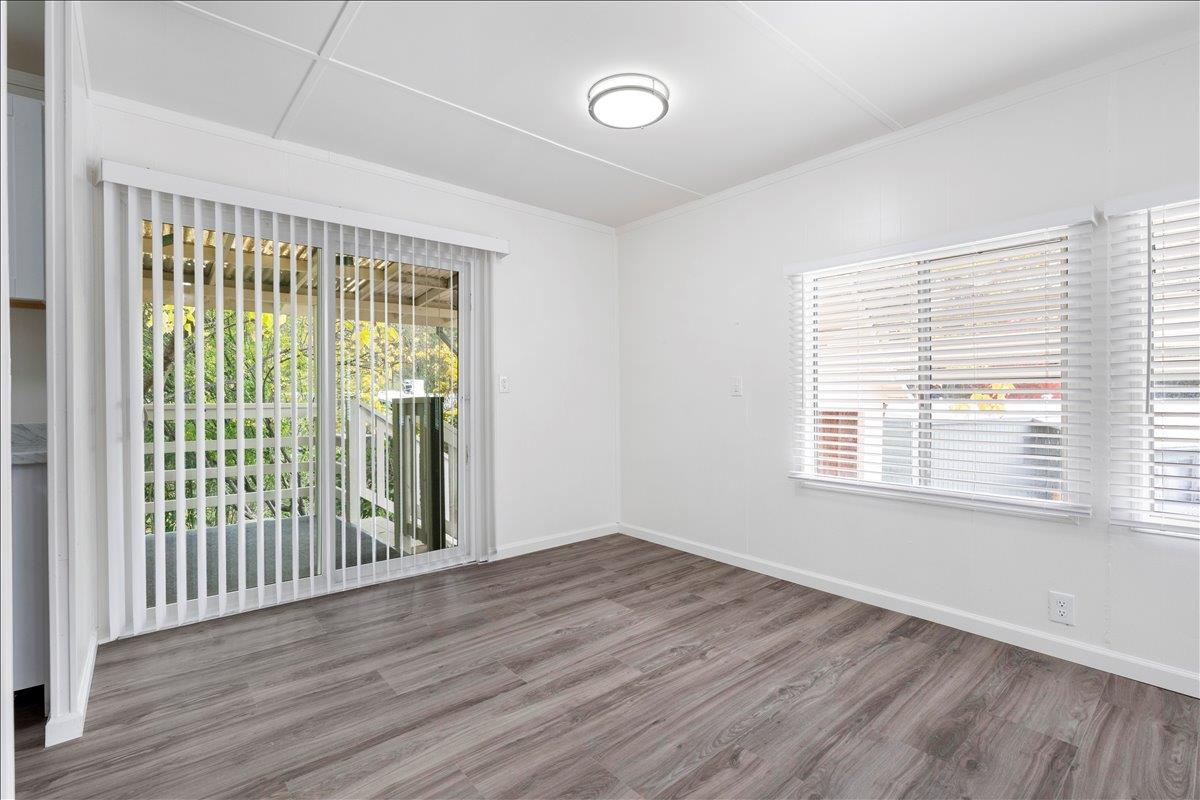 1525 Cold Springs Road, Unit 37 Placerville, CA 95667 - Photo 5 of 37 a view of an empty room with wooden floor and a window