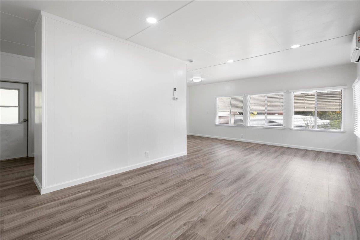 1525 Cold Springs Road, Unit 37 Placerville, CA 95667 - Photo 7 of 37 an empty room with wooden floor and windows